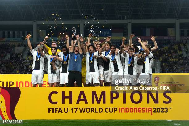 Christian Wueck, Head Coach of Germany, lifts the FIFA U-17 World Cup winners trophy following victory in the FIFA U-17 World Cup Final match between...