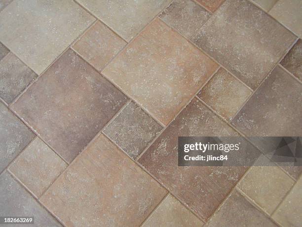 different sized and asymmetrically arranged tiles on floor - ceramic stockfoto's en -beelden