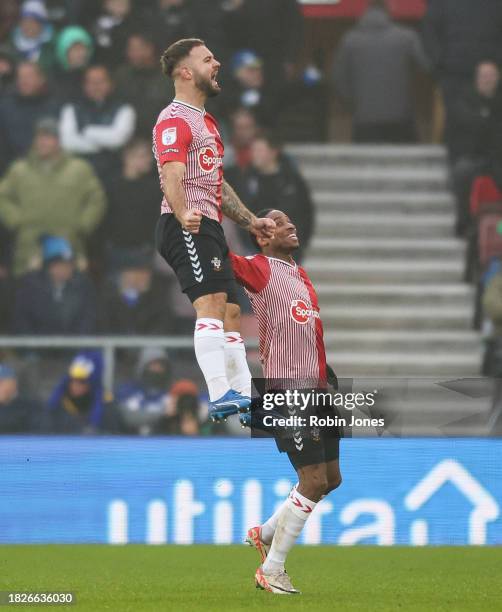 Kyle Walker-Peters of Southampton rushes to congratulate team-mate Adam Armstrong after he scores a goal to make it 1-0 during the Sky Bet...