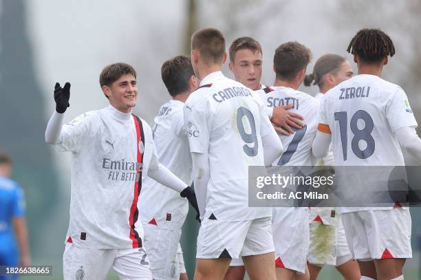 Mattia Liberali of AC Milan celebrates after scoring a goal during the Coppa Italia Primavera 1 match between Empoli U19 and AC Milan U19 at Stadio...