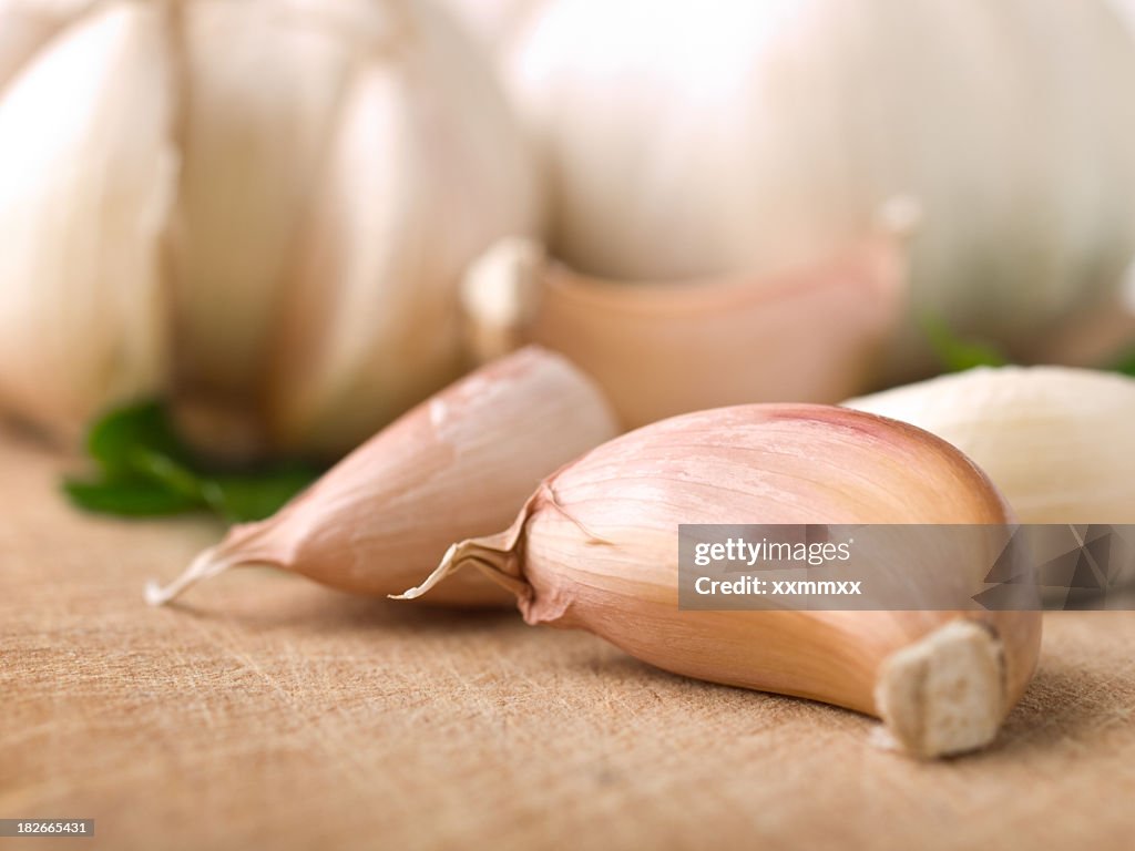 Close-up of garlic cloves laying on a table