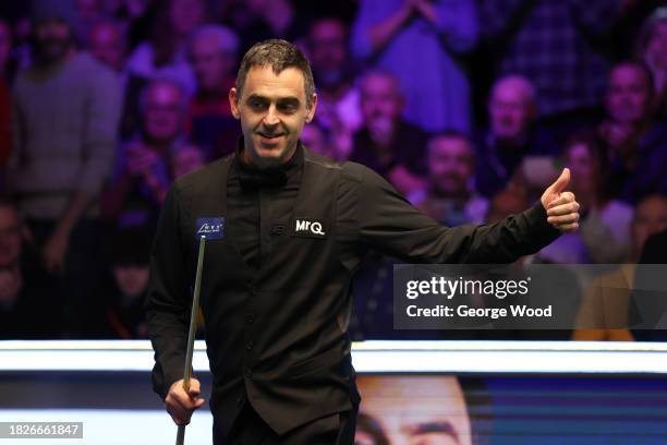 Ronnie O'Sullivan of England celebrates after victory against Hossein Vafaei of Iran in their Semi Final match on Day Eight of the MrQ UK Snooker...