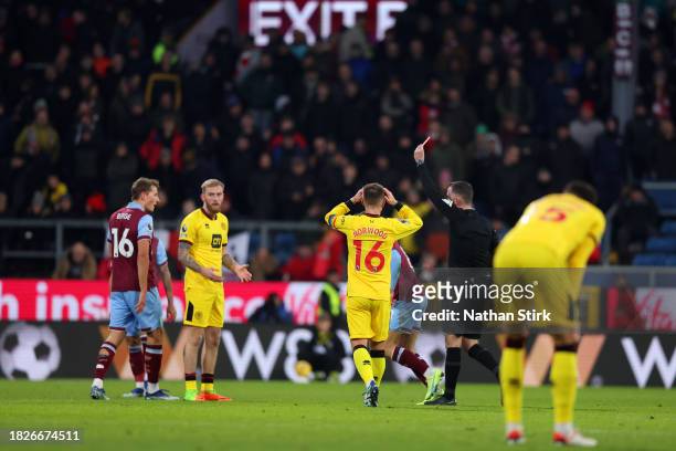 Oliver Norwood of Sheffield United reacts after teammate Oliver McBurnis is shown a red card by Referee Chris Kavanagh following a second yellow card...