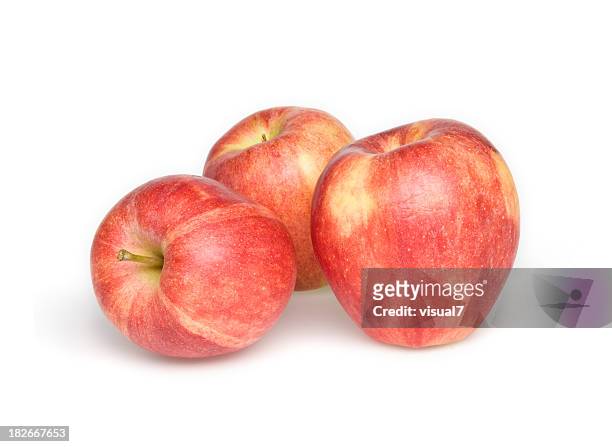 three red apples isolated on white background - red delicious stockfoto's en -beelden