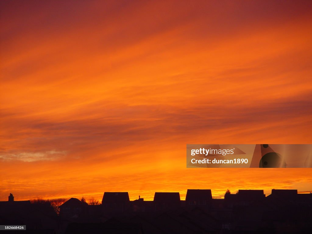 Clouds & Sunsets - Silhouetted houses