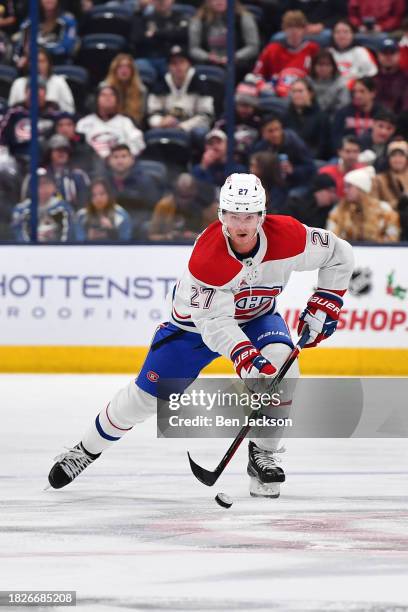 Gustav Lindstrom of the Montreal Canadiens skates with the puck during the second period of a game against the Columbus Blue Jackets at Nationwide...