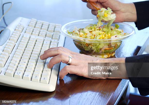 working and eating - quick dinner stock pictures, royalty-free photos & images