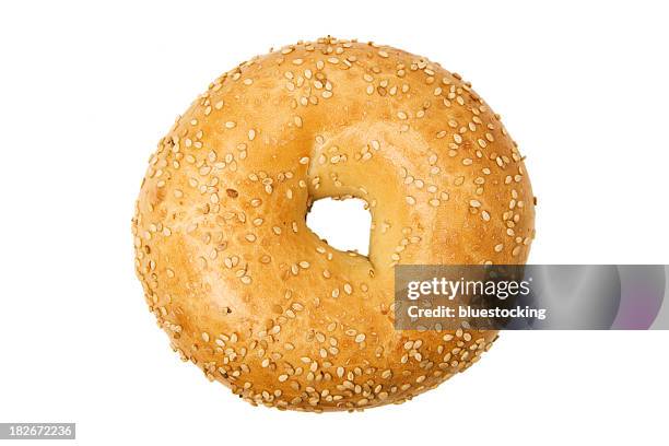 isolated close-up of of sesame bagel on a white background - bagel stock pictures, royalty-free photos & images