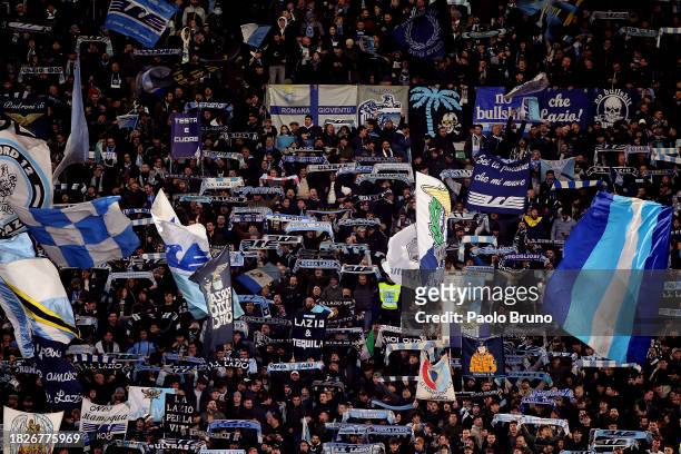 Fans of SS Lazio show their support by waving flags and holding scarves prior to the Serie A TIM match between SS Lazio and Cagliari Calcio at Stadio...