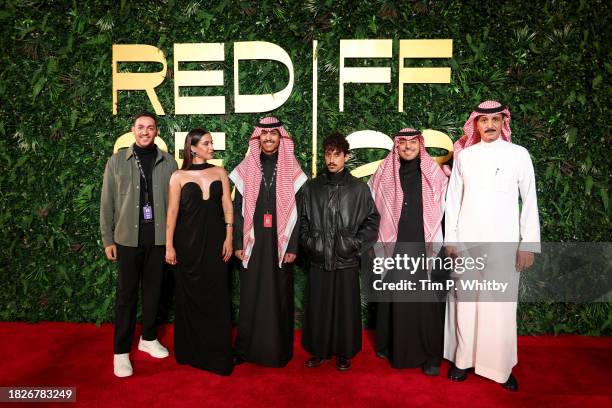 Guest, Adwa Bader, Yazeed Almajyul, Meshal Aljaser, Almotaz Aljefri and Gibran attend the red carpet for "Naga" during the Red Sea International Film...