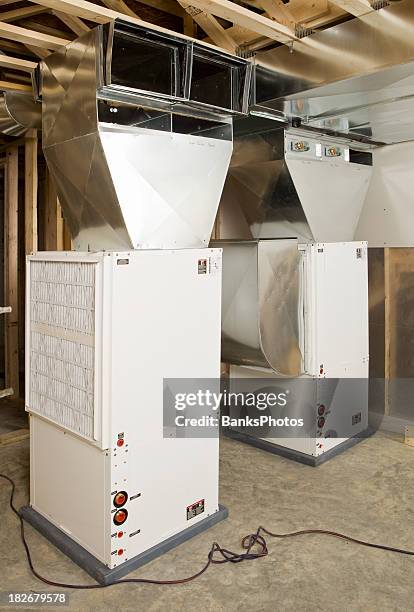 geothermal heating/air conditioning units installed in a new home - home furnace stock pictures, royalty-free photos & images