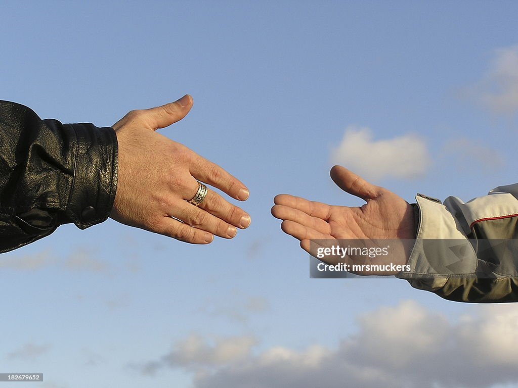 Agreement Handshake or Reaching Out 1