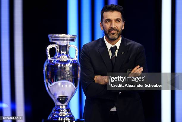 Special guest Gianluigi Buffon is seen with the UEFA EURO 2024 trophy during the UEFA EURO 2024 Final Tournament Draw at Elbphilharmonie on December...