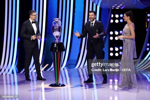 Presenters Esther Sedlaczek and Pedro Pinto and special guest Gianluigi Buffon​ speak during the UEFA EURO 2024 Final Tournament Draw at...