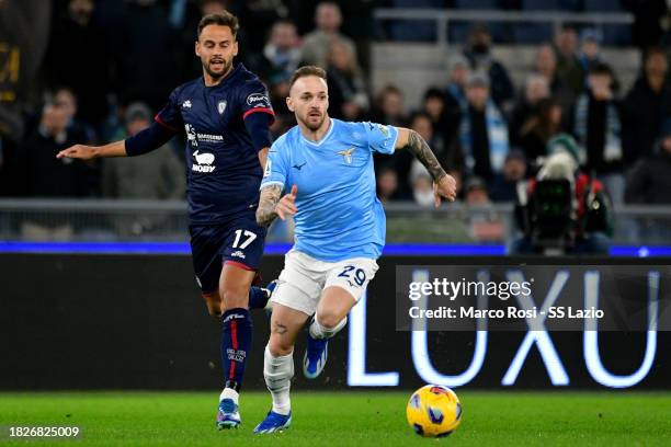 Manuel Lazzari of SS Lazio compete for the ball with Pantelis Hatzidiakos of Cagliari Calcioduring the Serie A TIM match between SS Lazio and...