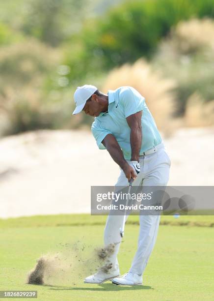 Tiger Woods of the United States plays his second shot on the third hole during the third round of the Hero World Challenge at Albany Golf Course on...