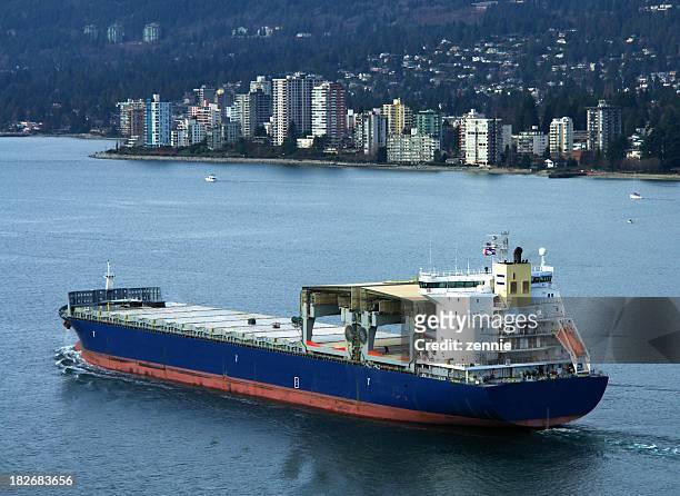 cargo ship leaving vancouver - vancouver harbour stock pictures, royalty-free photos & images