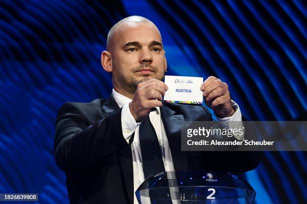 Special guest Wesley Sneijder​​ pulls out the card of Austria during the UEFA EURO 2024 Final Tournament Draw at Elbphilharmonie on December 02, 2023...