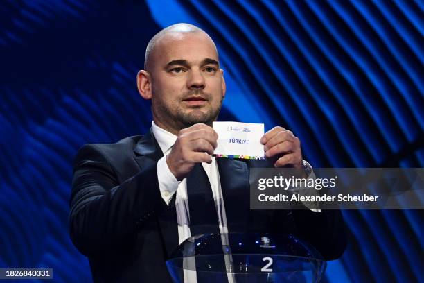 Special guest Wesley Sneijder​​ pulls out the card of Turkey during the UEFA EURO 2024 Final Tournament Draw at Elbphilharmonie on December 02, 2023...