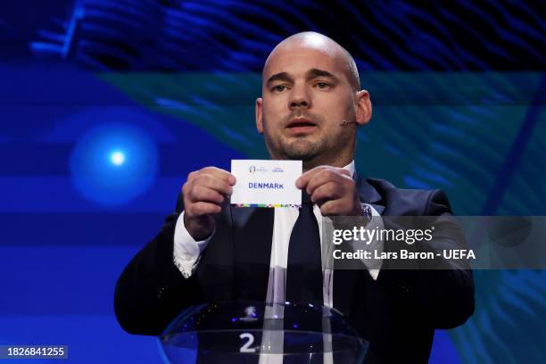 Special guest Wesley Sneijder​​ pulls out the card of Denmark during the UEFA EURO 2024 Final Tournament Draw at Elbphilharmonie on December 02, 2023...