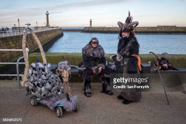Participants attend the annual Whitby Krampus run on December 02, 2023 in Whitby, England. The Whitby Krampus Run is a costumed street parade...