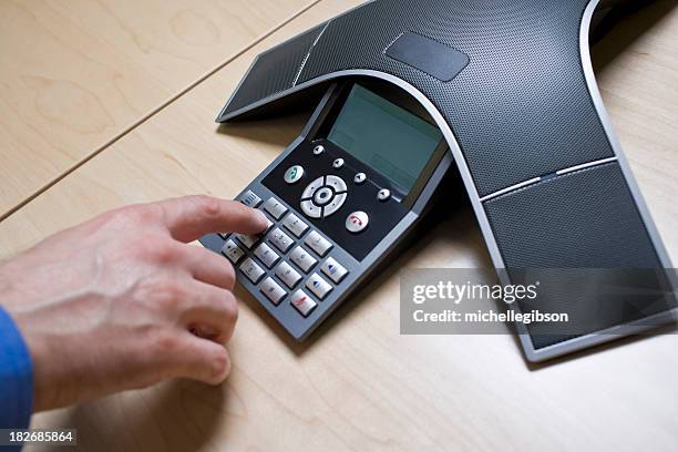 man has meeting on a conference call phone - voip stock pictures, royalty-free photos & images