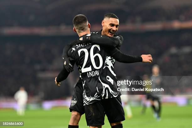 Deniz Undav of VfB Stuttgart celebrates with teammates after scoring the team's first goal during the Bundesliga match between VfB Stuttgart and SV...