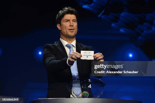 Special guest Brian Laudrup pulls out the card of play-off winner B during the UEFA EURO 2024 Final Tournament Draw at Elbphilharmonie on December...