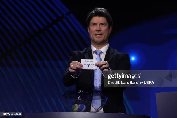 Special guest Brian Laudrup pulls out the card of play-off winner A during the UEFA EURO 2024 Final Tournament Draw at Elbphilharmonie on December...