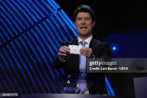 Special guest Brian Laudrup pulls out the card of Italy during the UEFA EURO 2024 Final Tournament Draw at Elbphilharmonie on December 02, 2023 in...