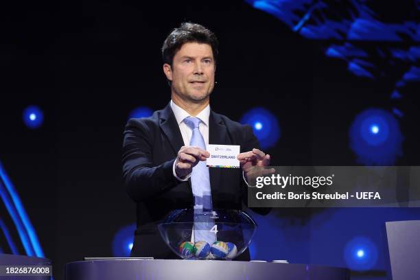 Special guest Brian Laudrup pulls out the card of Switzerland during the UEFA EURO 2024 Final Tournament Draw at Elbphilharmonie on December 02, 2023...