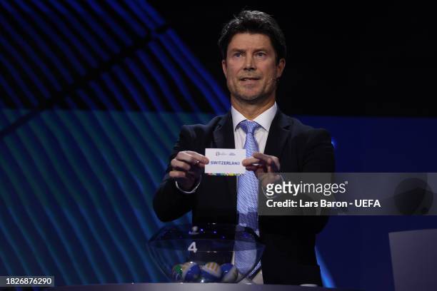Special guest Brian Laudrup pulls out the card of Switzerland during the UEFA EURO 2024 Final Tournament Draw at Elbphilharmonie on December 02, 2023...