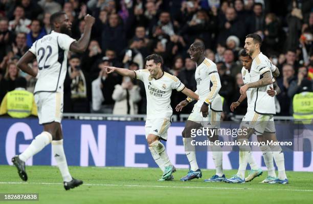 Brahim Diaz of Real Madrid celebrates with teammates after scoring the team's first goal during the LaLiga EA Sports match between Real Madrid CF and...