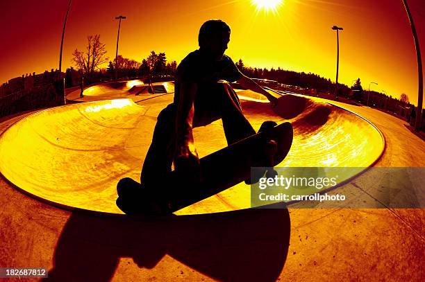 frontside silhouette grab - swimming pool hill stock pictures, royalty-free photos & images