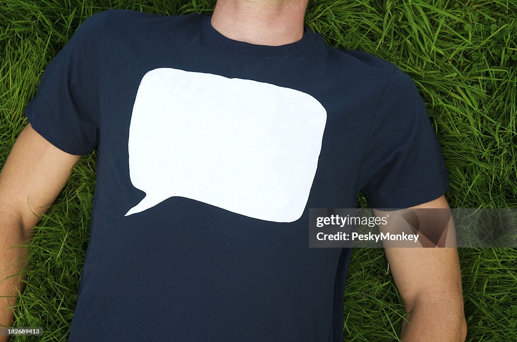 Blank speech bubble on T-shirt on grass