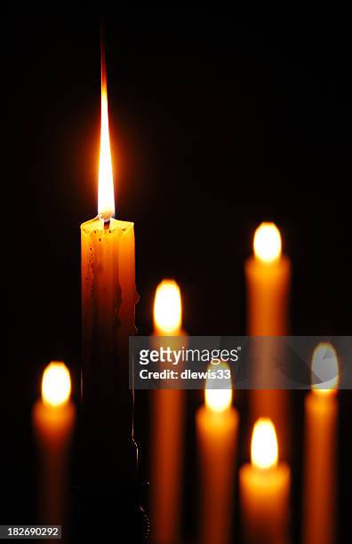 candle standing out - nachtwake stockfoto's en -beelden