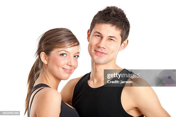 young attractive fitness couple - sportkleding stockfoto's en -beelden