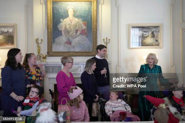 Britain's Queen Camilla welcomes parents children, supported by Helen & Douglas House and Roald Dahl's Marvellous Children's Charity, to decorate the...