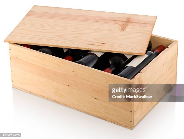 a partially opened wooden box full of red wine  - red wine stockfoto's en -beelden
