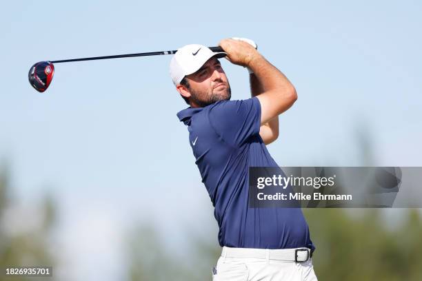 Scottie Scheffler of the United States plays his shot from the fourth tee during the third round of the Hero World Challenge at Albany Golf Course on...