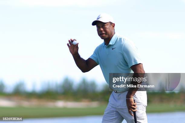 Tiger Woods of the United States reacts on the ninth green during the third round of the Hero World Challenge at Albany Golf Course on December 02,...