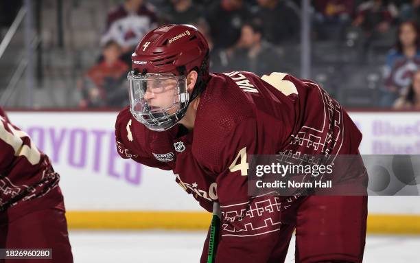 Juuso Valimaki of the Arizona Coyotes gets ready during a face off against the Colorado Avalanche at Mullett Arena on November 30, 2023 in Tempe,...