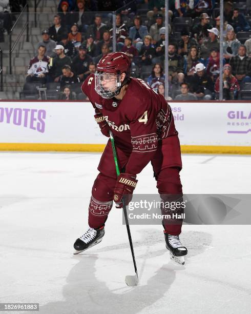 Juuso Valimaki of the Arizona Coyotes gets ready during a face off against the Colorado Avalanche at Mullett Arena on November 30, 2023 in Tempe,...