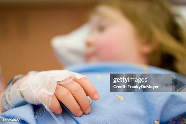 little child, tied to the hospital bed - tied to bed stockfoto's en -beelden
