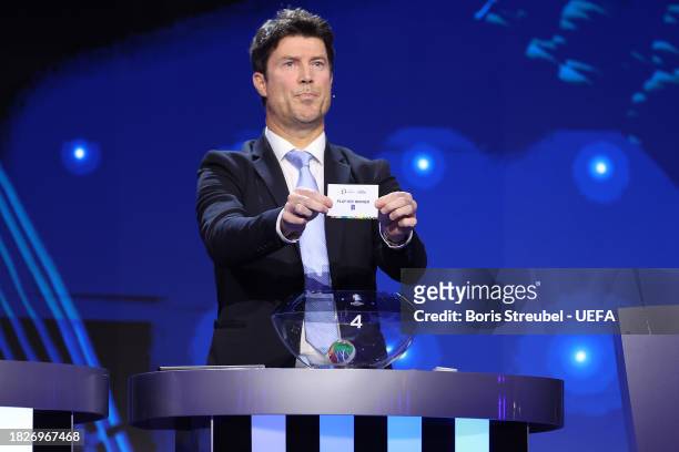 Special guest Brian Laudrup pulls out the card of Play-Off Winner B during the UEFA EURO 2024 Final Tournament Draw at Elbphilharmonie on December...
