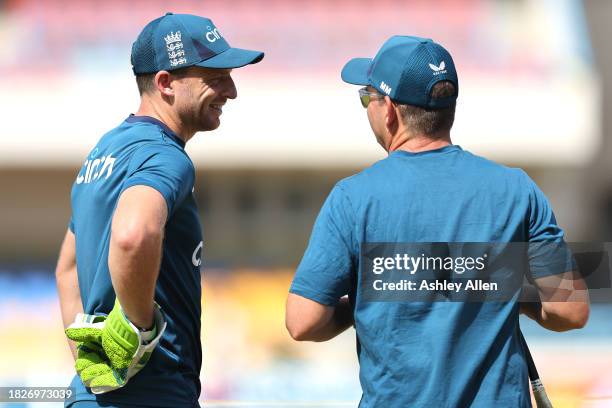 Jos Buttler and head coach of England, Matthew Mott chat during a Nets and Training session ahead of the first ODI during CG United One Day...