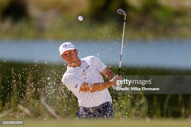 Jordan Spieth of the United States plays a shot from a bunker on the fifth hole during the third round of the Hero World Challenge at Albany Golf...