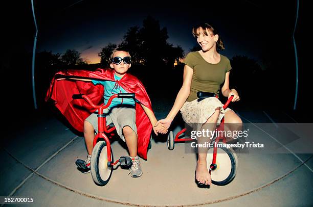 superheld lieben - tricycle stock-fotos und bilder