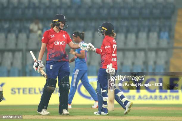 Nat Sciver-Brunt of England and Danielle Wyatt of England interact during the 1st T20 International match between India Women and England Women at...