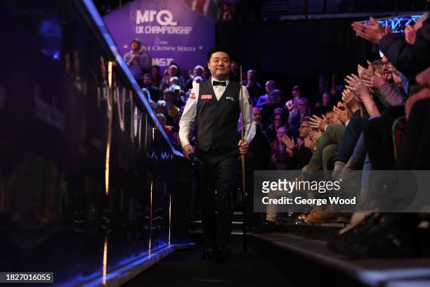 Ding Junhui of China walks out to play Judd Trump of England in their Semi Final match on Day Eight of the MrQ UK Snooker Championship 2023 at York...